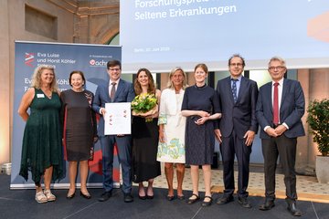 Award ceremony, several people on stage